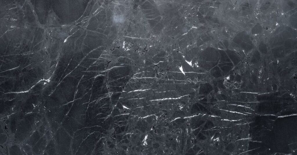 High-resolution dark marble texture, perfect for elegant backgrounds and design projects.