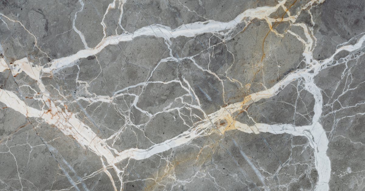 Detailed close-up of natural marble surface showcasing intricate vein patterns for design projects.